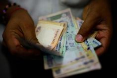 Rupee opens marginally higher against US dollar